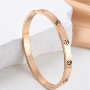 Rose Gold-Tone Bracelet with Crystal Zircon Accents. Stainless steel. 6in wrist